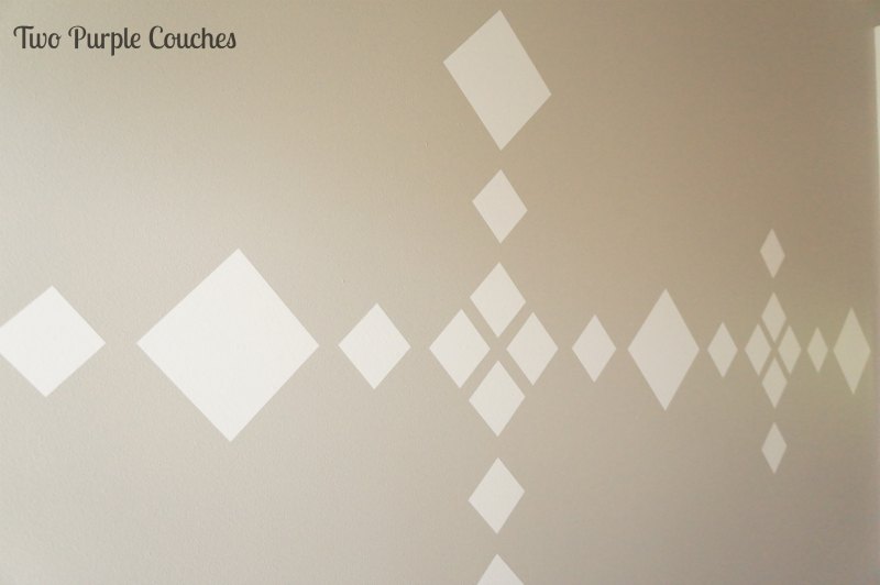 Wall Decal Installation by Two Purple Couches #accentwall #walldecal #cozywallart