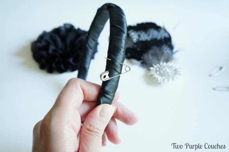 Use a safety pin to mark the spot on your headband where you like your embellishments to go. via www.twopurplecouches.com
