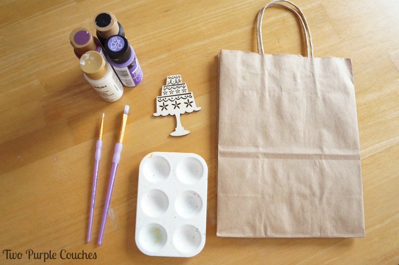 What you'll need: a plain gift bag, wood shapes, acrylic craft paints and paint brushes. via www.twopurplecouches.com 