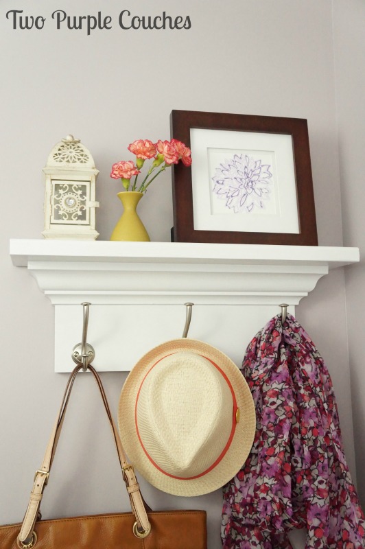 Built your own wall shelf with hooks! Get the tutorial at www.twopurplecouches.com
