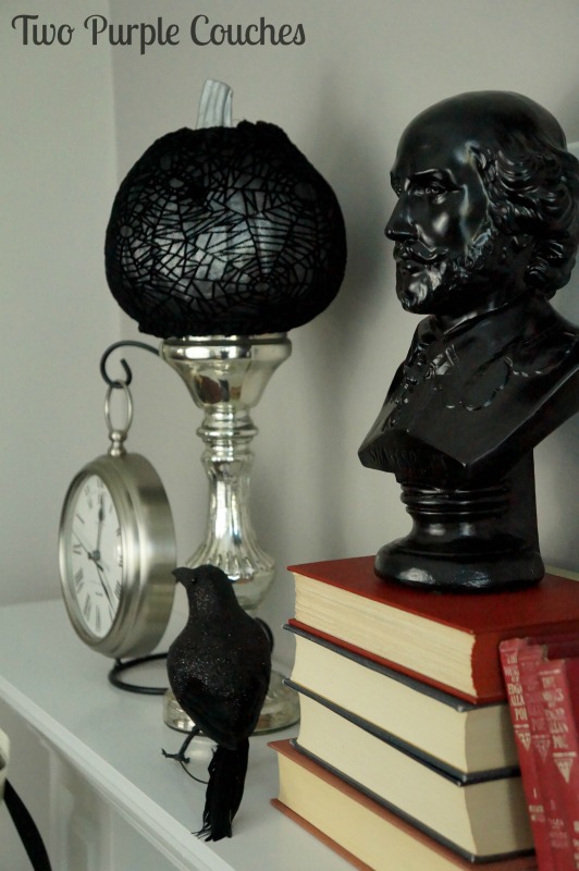 Complete your spooky literary-inspired Halloween mantel decor with a bust of a dead author. via www.twopurplecouches.com