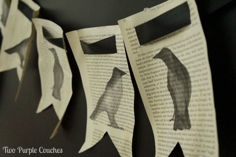 This is so perfect for Halloween! Raven silhouettes painted onto book pages and turned into a cute banner. via www.twopurplecouches.com