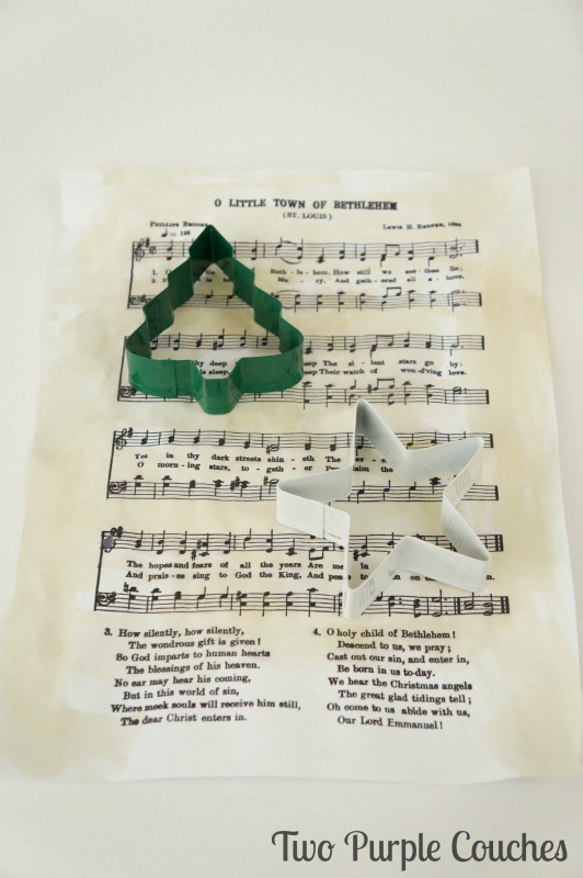 Tip: use cookie cutters to cut festive shapes out of sheet music for DIY Christmas ornaments