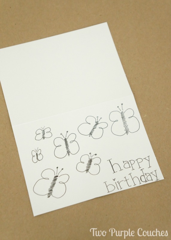 Simple hand-drawn butterflies adorn a birthday card.