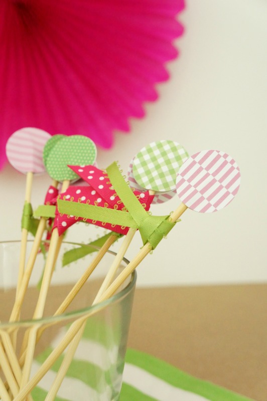 Learn how to make these cocktail stirrers using paper, ribbon and bamboo skewers. These are perfect party accessories for a shower, birthday or engagement party!