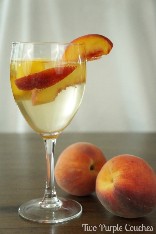 Best summer sangria recipe! This peach sangria recipe combines crisp white wine, peach schnapps and ginger simple syrup for a sweet, refreshing spritzer.