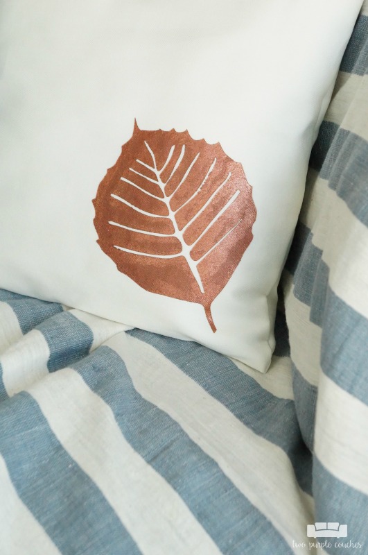 Learn how to use your cutting machine to create a stencil and create this fall leaf throw pillow! An easy way to update throw pillows for each season!