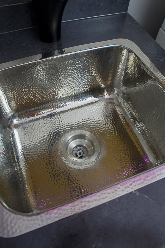 polished stainless laundry sink