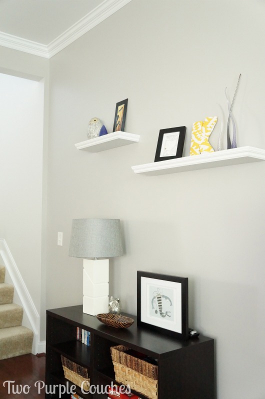 House Tour Family Room Wall Shelves by Two Purple Couches