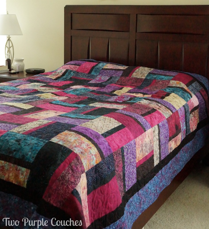 This queen size quilt was handmade by my mom and I for my bedroom. We chose a pattern of alternating rectangles and used all batik fabrics. www.twopurplecouches.com