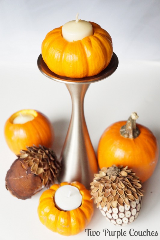 Create a beautiful Thanksgiving centerpiece by turning mini pumpkins into candle holders! Easy step-by-step tutorial included. via www.twopurplecouches.com