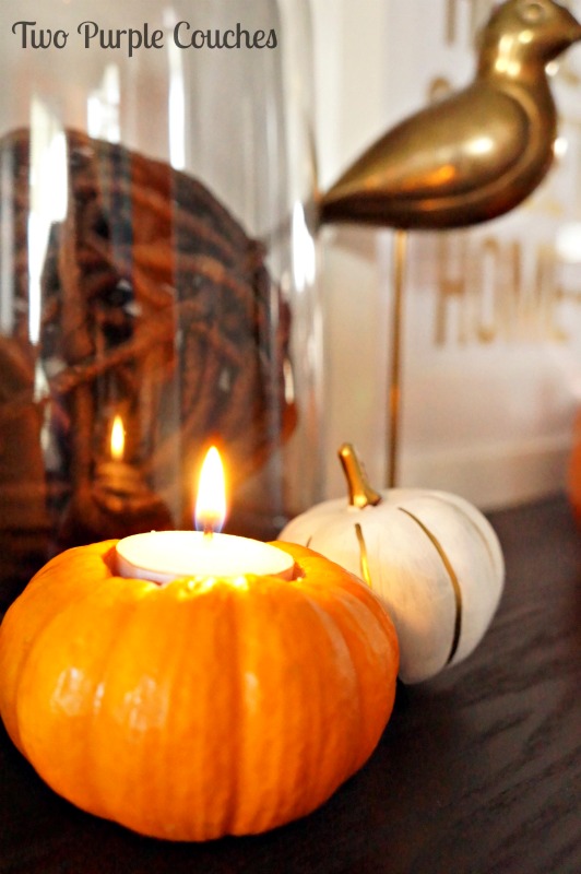 Love this so much for Thanksgiving decorating! Mini pumpkins made into candle holders! Tutorial included. via www.twopurplecouches.com