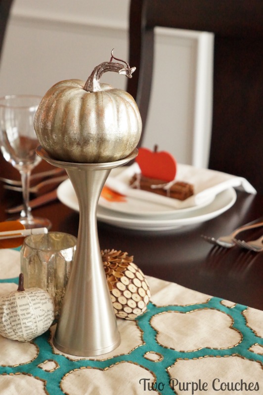 Beautiful metallic pumpkins and accents make this Thanksgiving table feel bright and modern. via www.twopurplecouches.com 