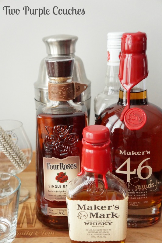 Gather a few bottles of bourbon, or your favorite liquor, to create your own tasting bar. via www.twopurplecouches.com