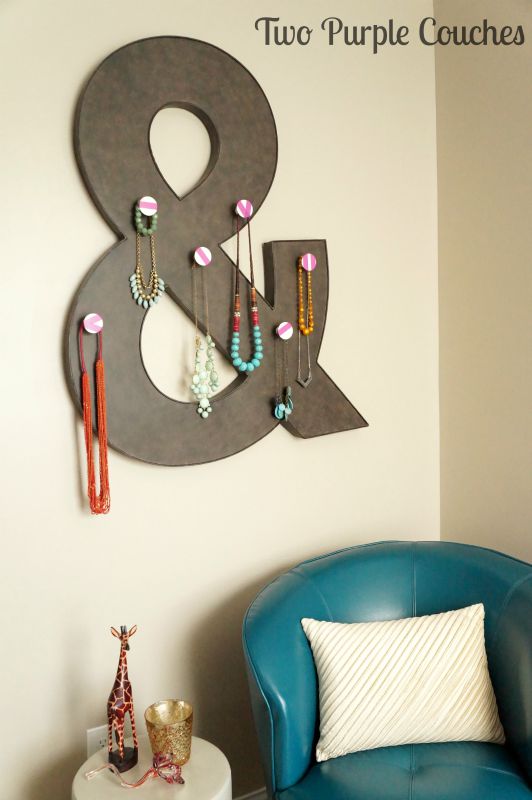 Unique way to display your jewelry on your bedroom wall using metal wall decor and knobs. via www.twopurplecouches.com