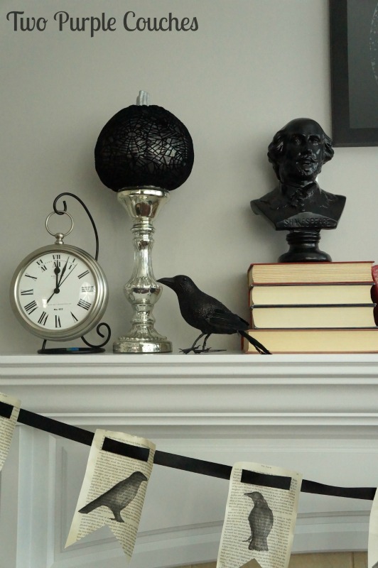 Create a spooky literary-inspired mantel with stacks of old books, a book page banner, and a raven. via www.twopurplecouches.com
