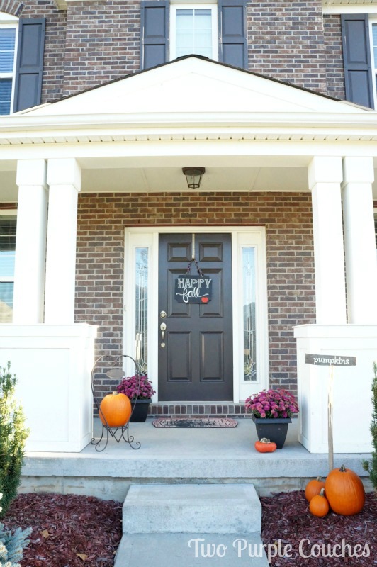 Create a welcoming entry to your home this Fall with clusters of pumpkins and potted mums. via www.twopurplecouches.com