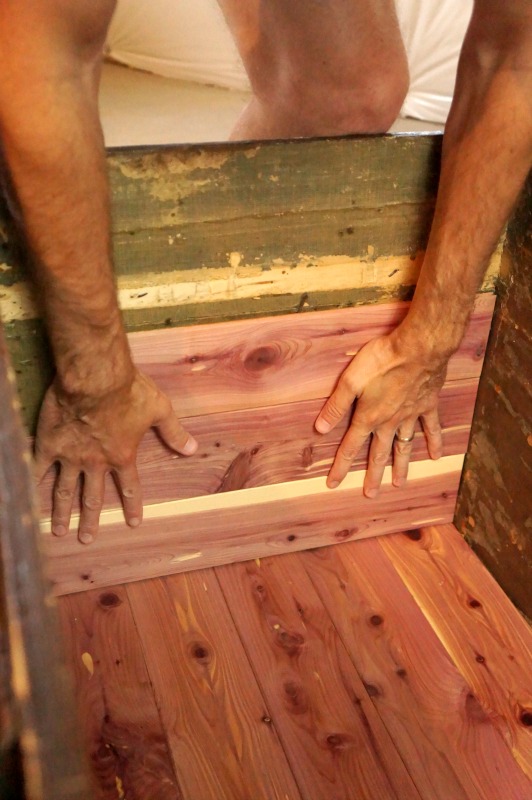 https://twopurplecouches.com/wp-content/uploads/2015/10/installing-diy-cedar-lining-to-trunk.jpg