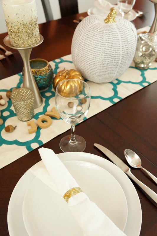 Neutral Thanksgiving table centerpiece with pops of teal