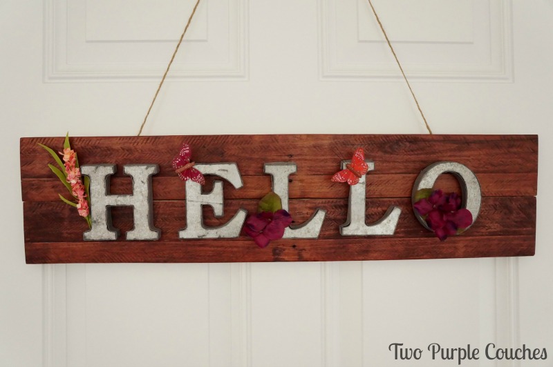 How to make an adorable springtime pallet wood sign for your home or front door.