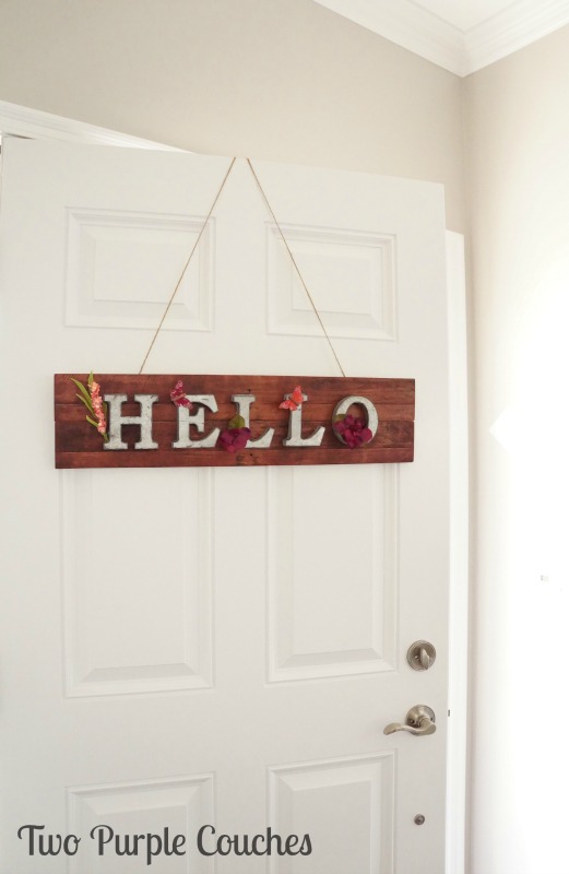 How to make an adorable springtime pallet wood sign for your home or front door.