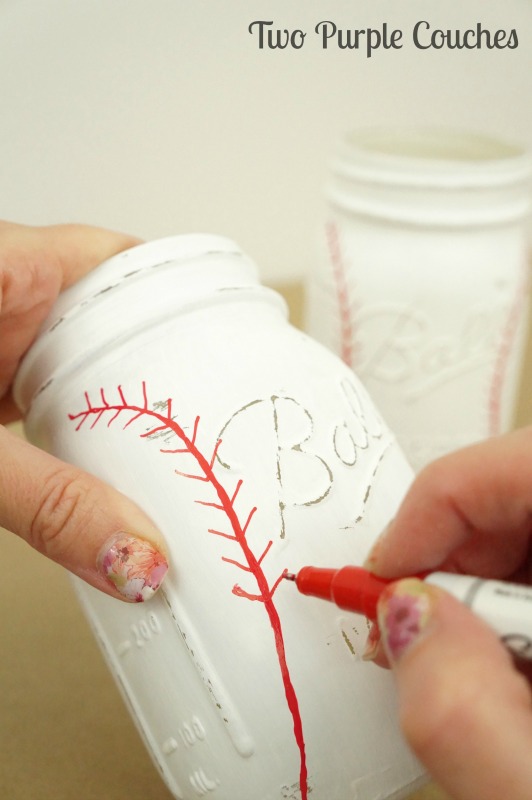 Add stitching with a red paint pen to create your own baseball mason jar