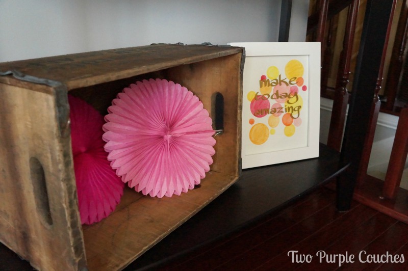 Vintage drink crate and tissue paper rosettes party decor