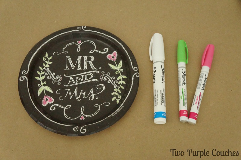 Add flourishes to a chalkboard-style monogram using a paint pen. 
