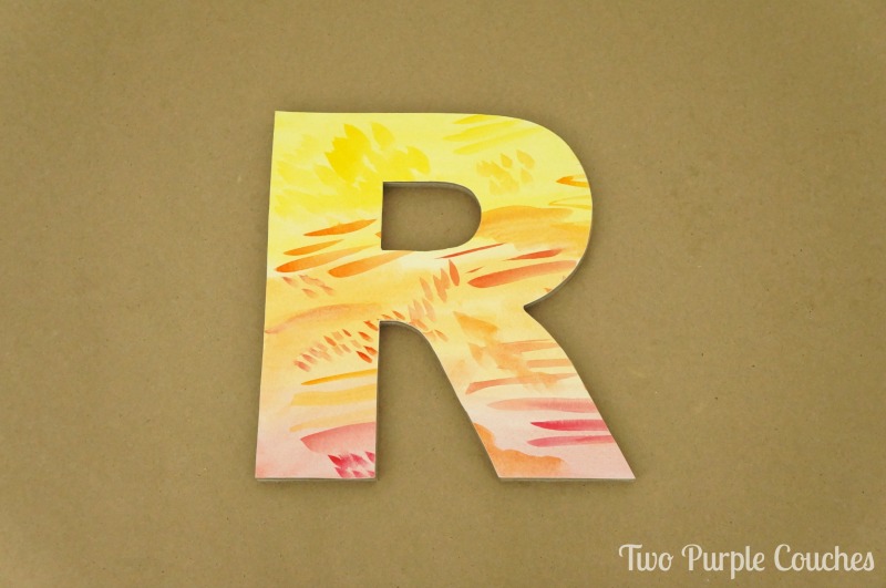 Make your own pretty watercolor letter wall decor following this simple tutorials. These letters and monograms are perfect for a bedroom or home office. 