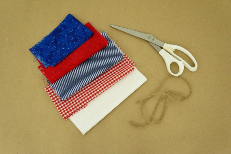 Follow this simple step-by-step tutorial to make your own fabric garland. Use red, white and blue fabrics to add a patriotic touch to your summer decor!