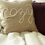 This DIY Fall Pillow is the perfect no sew idea for neutral decor with a farmhouse flair. Learn how to create your own “cozy” pillow cover with rope trim!