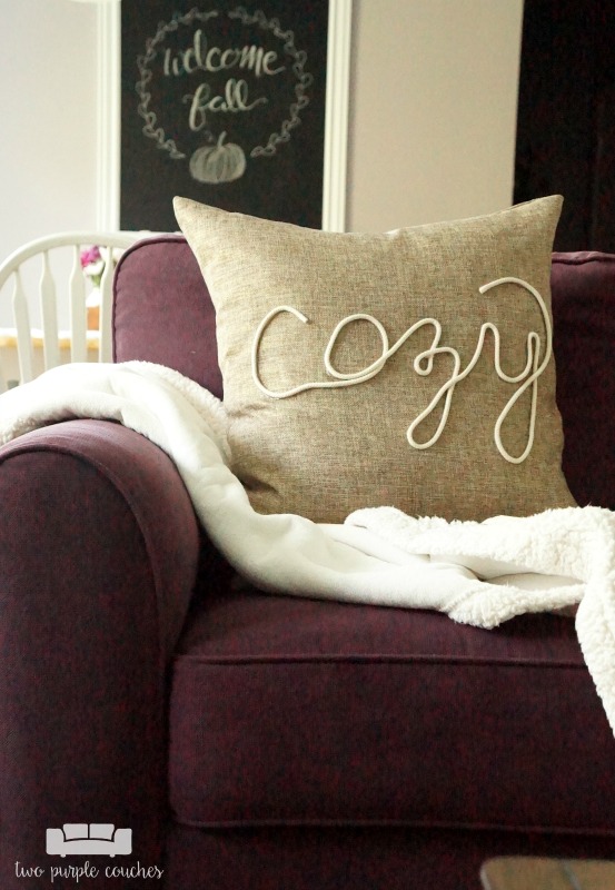 Create your own "cozy" DIY fall pillow cover with this simple technique using rope trim and hot glue! This idea is perfect for fall or winter decorating!