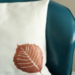 Learn how to use your cutting machine to create a stencil and create this fall leaf throw pillow! An easy way to update throw pillows for each season!