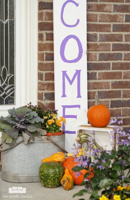 Learn how easy it is to make your own large porch sign and create a warm welcome for guests. Love how this looks and it's so easy to customize!