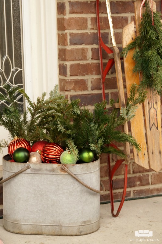 Beautiful vintage-inspired Christmas porch decor - what a pretty way to decorate your front porch for the holiday season! I love the sled and post box!