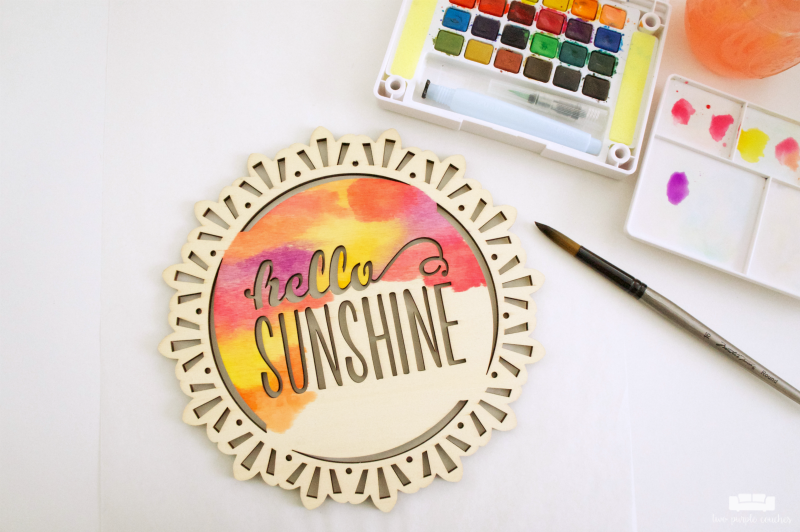 Did you know you can use watercolor paints on wood? Use inexpensive store-bought signs to create your own wood plaque art for your home!