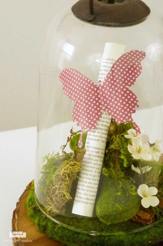 Create a beautiful centerpiece for your home with this simple spring butterfly cloche decor idea. Just add flowers, moss and butterflies! 