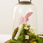 Create a beautiful centerpiece for your home with this simple spring butterfly cloche decor idea. Just add flowers, moss and butterflies!