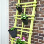 DIY Vertical Garden Trellis Makeover. Transform your outdoor patio decor with a modern painted vertical garden trellis. Great way to display flowers, herbs.