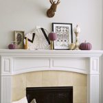 Fall mantel decorations get a modern, tribal inspired makeover with simple neutral accents and colorful purple pumpkins. Try these DIY ideas in your home!