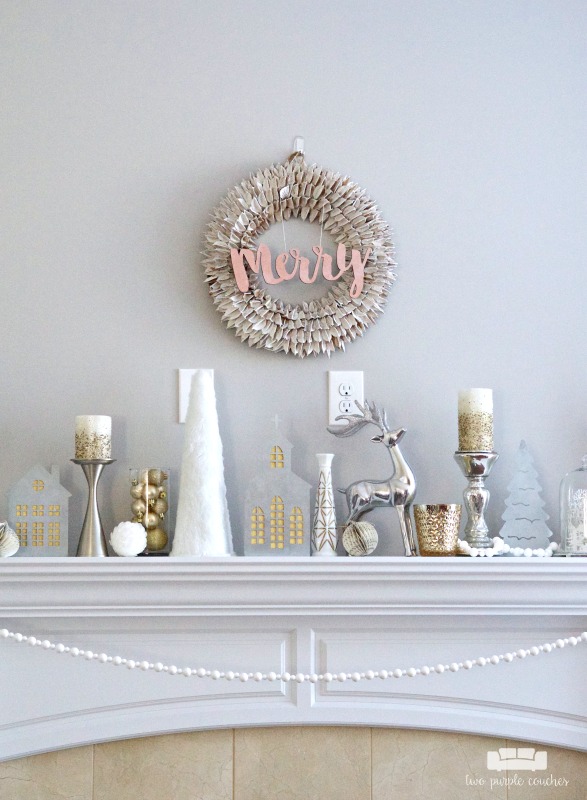 This Christmas mantel decor creates a gorgeous, elegant look with neutral metallics using a beautiful blend of white, silver, gold and mercury glass.