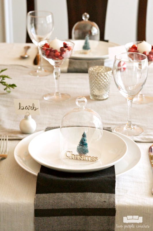 I love this simple place setting for Christmas and the holidays! White plates, plaid napkins and a bottlebrush tree! So cute!