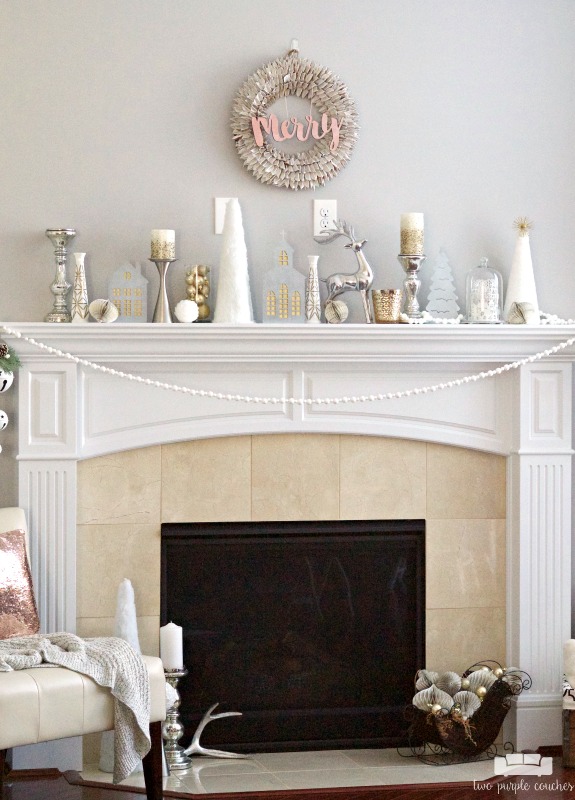 Gorgeous holiday mantel with a pretty modern wreath