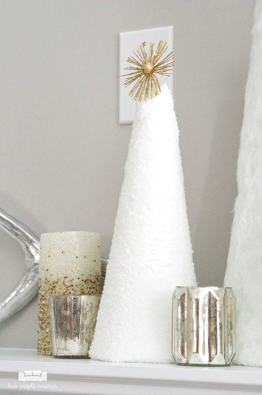 Beautiful idea for winter decorating - use simple white cone trees paired with candles!