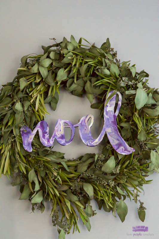 Noel sign created with DIY acrylic paint pouring technique turns a wooden sign into a unique and beautiful modern Christmas decoration!