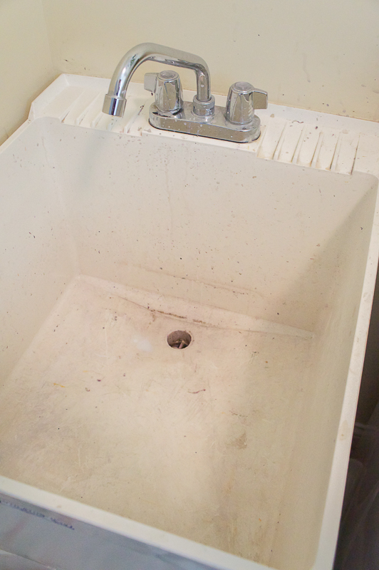 old plastic utility laundry sink